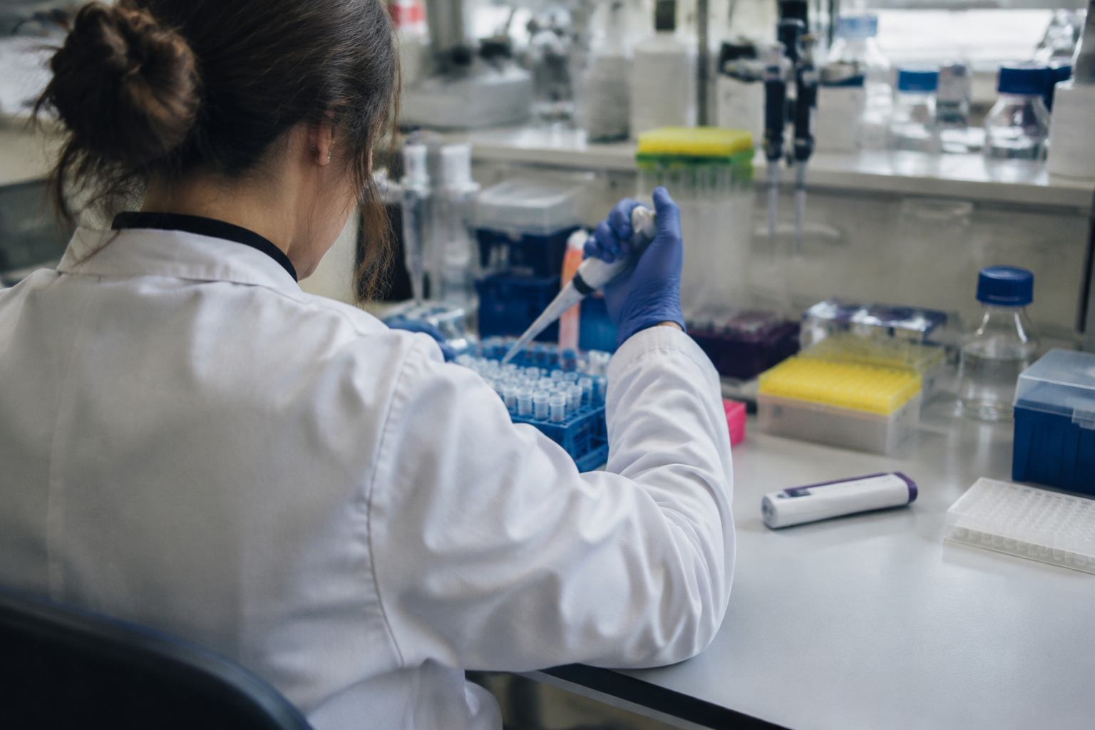 Researcher working with sample tubes at a university laboratory bench as GLP-1 medicines draw wider study